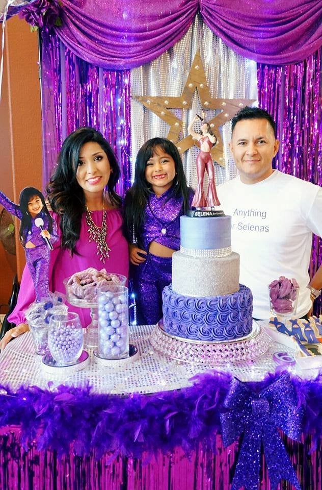 Ayvah poses with her parents. Check out dad's "Anything for Selenas" t-shirt!