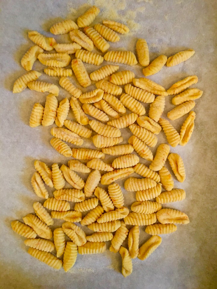 <p>Saffron-colored and -flavored malloreddus, freshly made.</p>