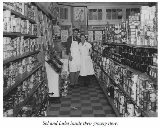 Sol and Luba inside their grocery shop