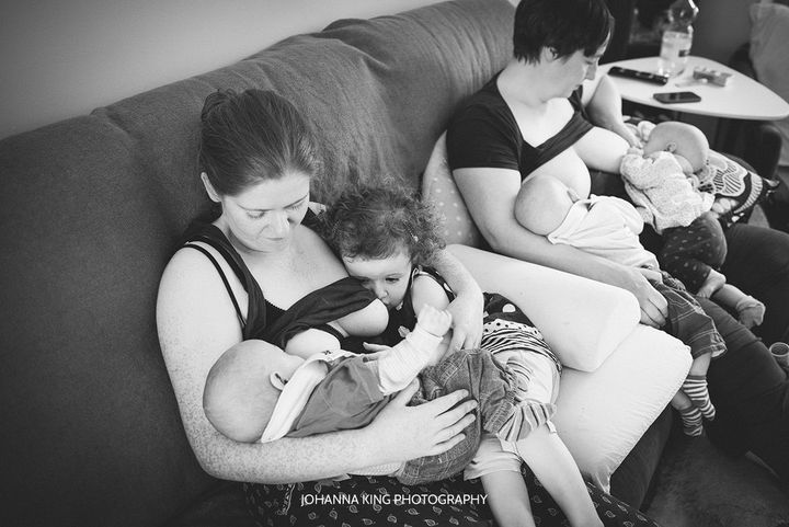 Cliona and Sue both nurse their toddler daughter and infant triplets.