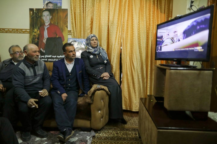 The parents and relatives of Palestinian Abd Elfatah Ashareef watch the TV broadcast of the sentencing. 