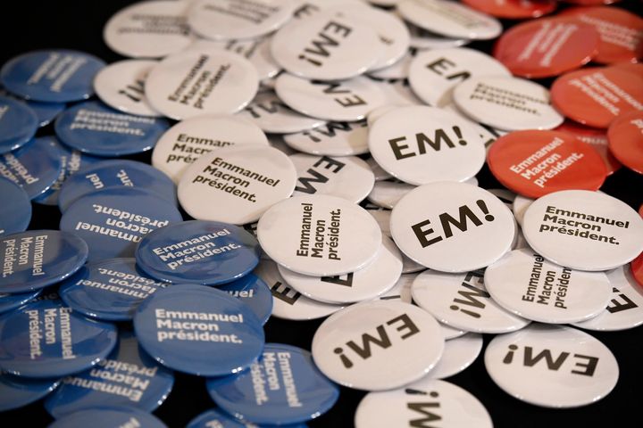Campaign badges for Emmanuel Macron, candidate in France's 2017 French presidential election, are seen before he delivers an address for French nationals in London.