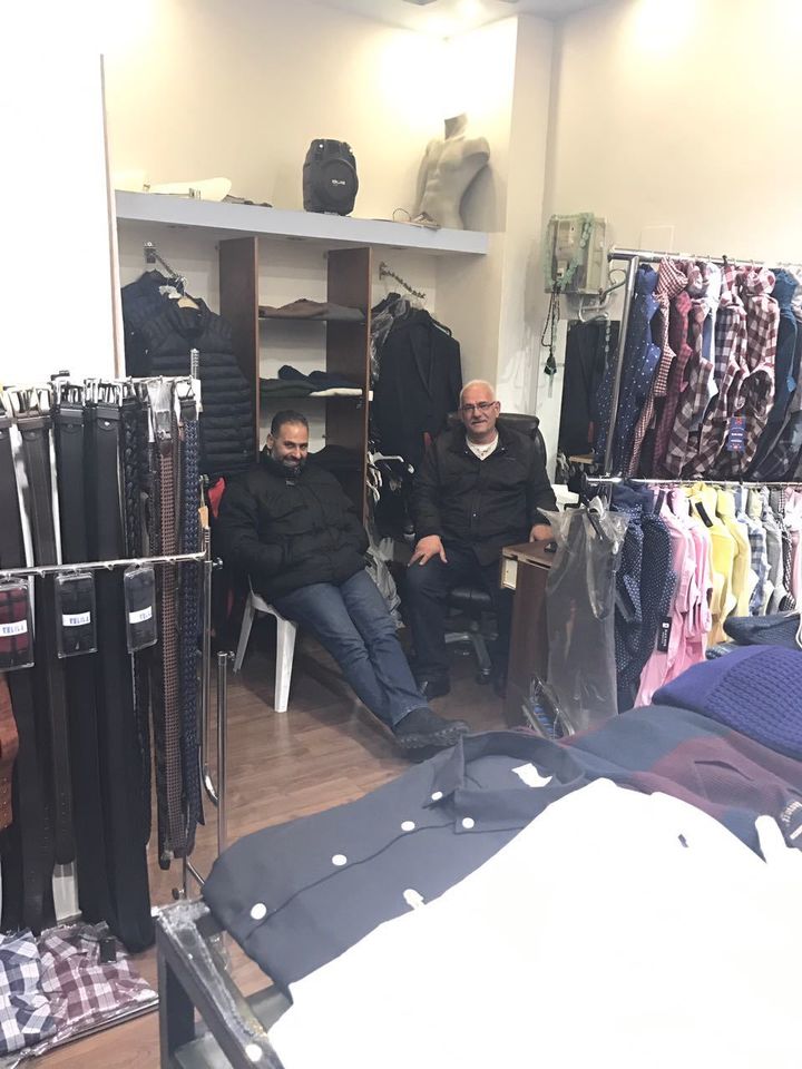 A shy George and Yacoub’s father Yousef sends their regards from the fashion shop in Bethlehem