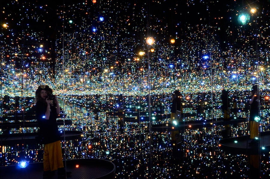 Yayoi Kusama, "Infinity Mirrored Room – The Souls of Millions of Light Years Away," 2013, at the Hirshhorn Museum and Sculpture Garden<em>, w</em>ood, metal, glass mirrors, plastic, acrylic panel, rubber, LED lighting system, acrylic balls, and water.