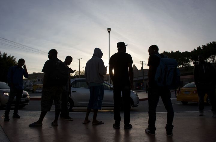 Migrants seeking asylum in the United States, wait at El Chaparral border crossing