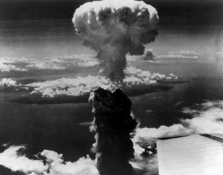 Smoke billows over Nagasaki, Japan after the atomic bomb was dropped on the city. August 9, 1945.