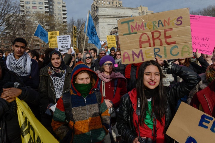 People participate in a protest on Feb. 11 against President Donald Trump's immigration policy and the recent Immigration and