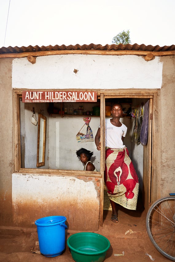 Felicity takes a break from working on a customer’s hair, in the salon of her teacher, Hilder Lapson. Felicity has taken over