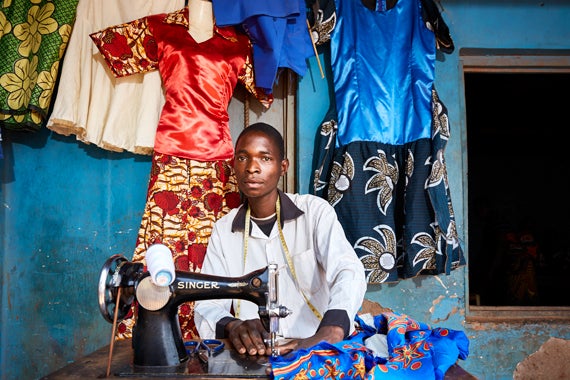 Lex Segwa, 22 years old, works on one of his dress designs at his tailoring workshop near Luchenza, southern Malawi.