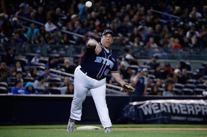 Chris Christie throws a sports ball. 