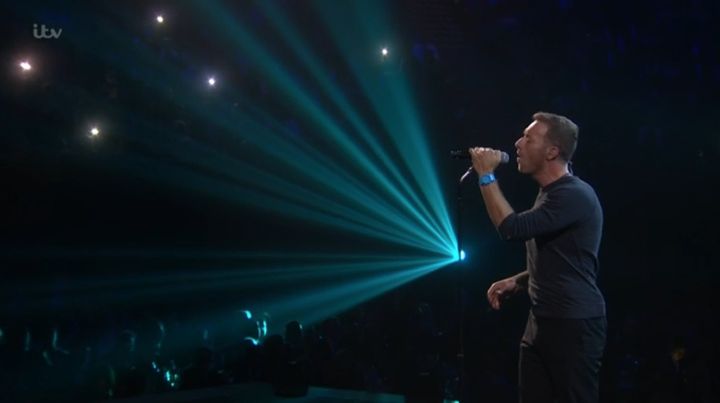 Chris Martin on stage at the Brits