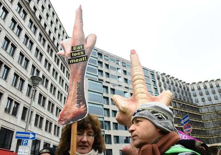 Protesters hold a sign reading "Eat less meat" while taking part in a demonstration during International Green Week in Berlin, Germany, January 16, 2016. Vegetarianism is reportedly on the rise in the country.