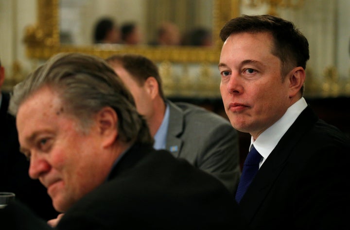 Tesla CEO Elon Musk (R) sits beside Senior Counselor to the President Steve Bannon (L) as U.S. President Donald Trump hosts a strategy and policy forum with chief executives of major U.S. companies at the White House in Washington February 3, 2017.