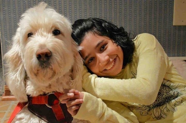 Ehlena Fry and her trained service dog, Wonder, are shown in this handout photo provided by the American Civil Liberties Union. Family photo, courtesy ACLU