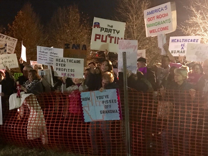 Protestors gathered outside a town hall meeting hosted by Rep. Leonard Lance (R-N.J.) in Branchburg, New Jersey, on Wednesday