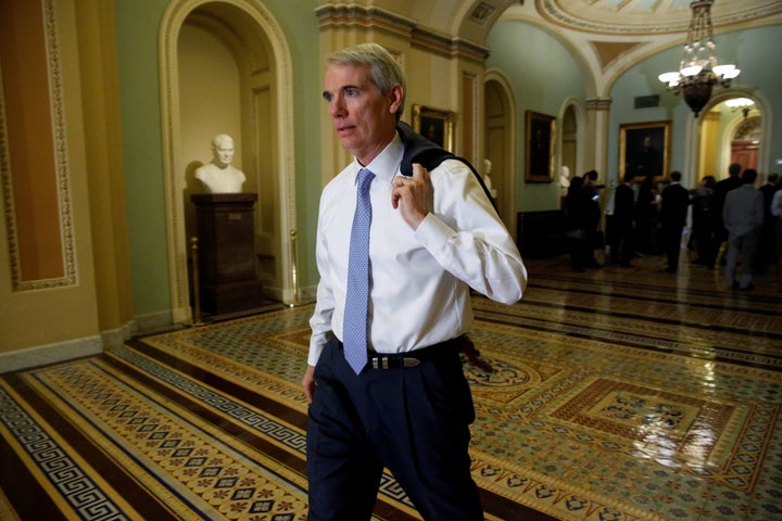 About 100 protesters gathered outside the event that Sen. Rob Portman (R-Ohio) held on Wednesday, calling on him to hold President Donald Trump accountable.