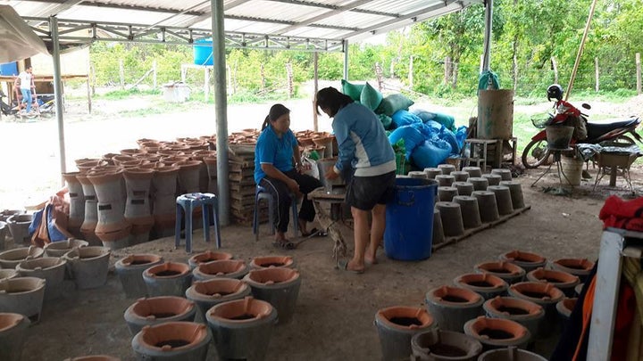 In Laos, a fuel-efficient cook stove production center.