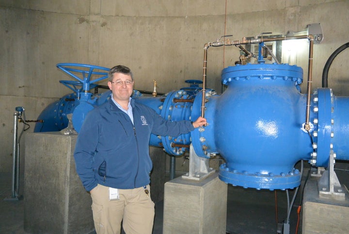Jonathan Sherer of the Columbia, South Carolina, water department shows off a pump paid for with a $100 million municipal bon