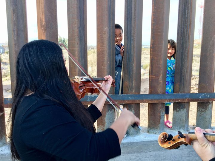 UTEP String Quartet provide early morning serenade to pajama-clad Mexican children across the border -near El Paso/Juarez