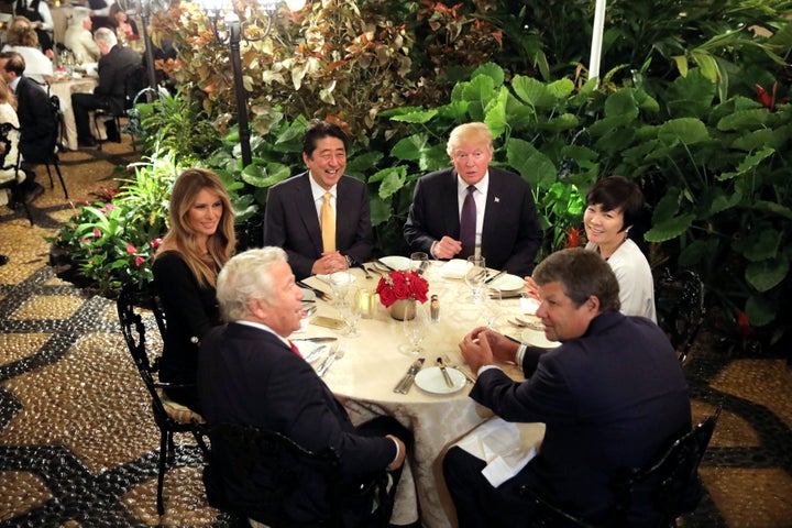 Donald Trump and his wife, Melania, with Japanese Prime Minister Shinzo Abe and his wife, Akie, at a dining room of Trump's M