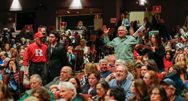 People react in agreement to a question posed to New Jersey Republican Congressman Leonard Lance during a town hall meeting at Raritan Valley Community College on February 22, 2017 in Branchburg, New Jersey.