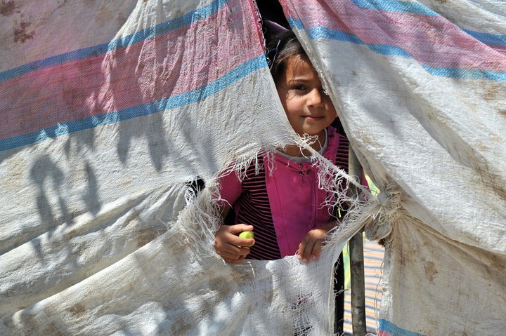 TURKISH-SYRIAN BORDER -JUNE 11, 2011: unidentified Syrian refugees, protested at the syria border