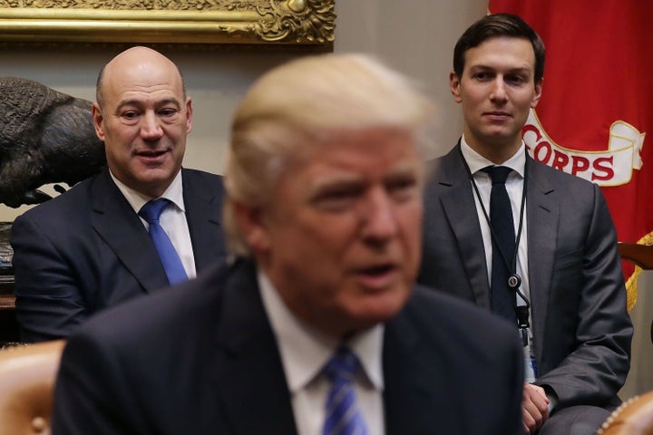 From left to right, Gary Cohn, President Donald Trump and Jared Kushner sit in the Roosevelt Room at the White House, Jan. 23, 2017.