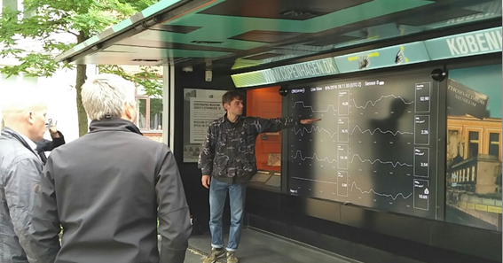 An open-air digital dashboard display in Central Copenhagen providing read-outs of street air quality monitoring devices.