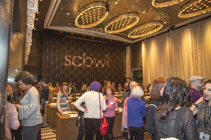 SCBWI Winter Conference attendees view more than 200 illustrator portfolios in the conference showcase.