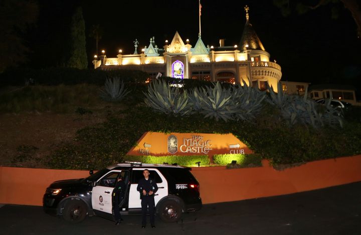 Los Angeles Police Department officers are seen outside of the Magic Castle magicians' club in Hollywood, California, on Friday night.