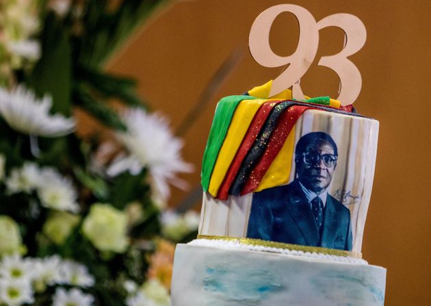 A birthday cake bears a portrait of Zimbabwe's President Robert