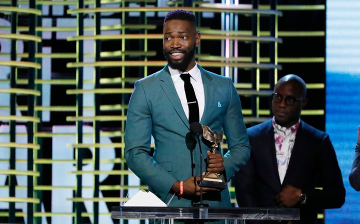 Tarell Alvin McCraney and Barry Jenkins accept the Best Screenplay award for "Moonlight" at the 2017 Film Independent Spirit
