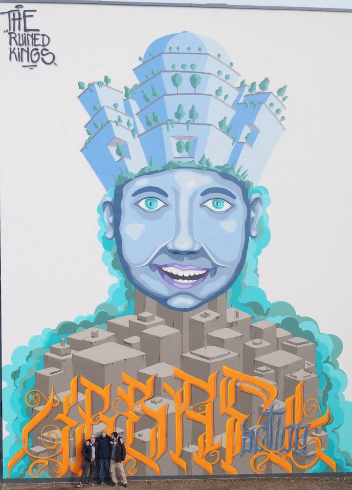 <p>Members of The Ruined Kings in front of the completed mural commissioned by the UN-Habitat Youth Advisory Board.</p>
