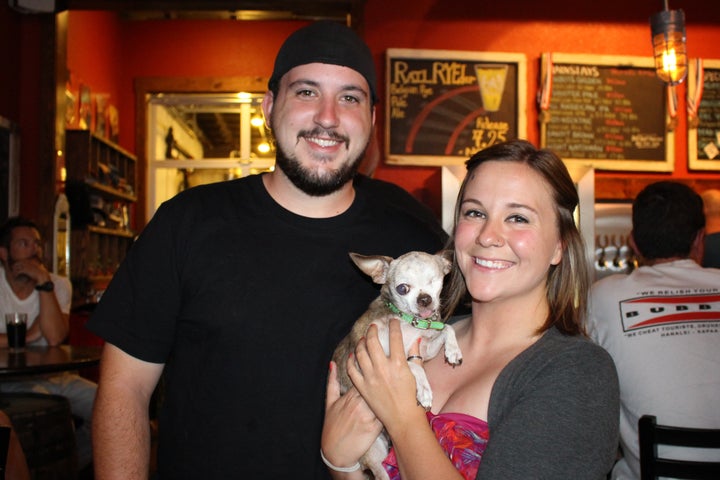 <p>Mindi Callison and husband, Jason Long with puppy mill survivor, Harley</p>