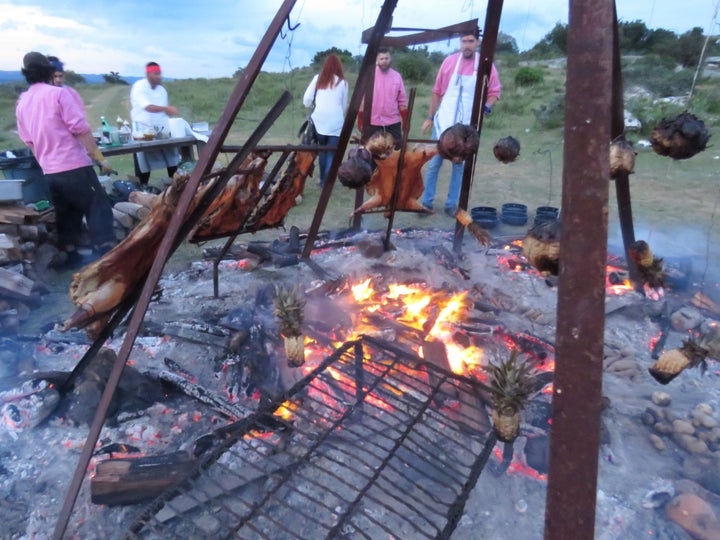 <p>Mallmann’s team masterfully manages fire over nine hours to produce a succulent, mouth-watering feast</p>