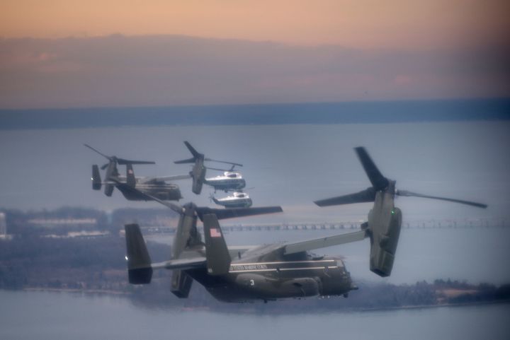 Marine One with US President Donald Trump flies with a decoy and support helicopters to Dover Air Force Base on February 1