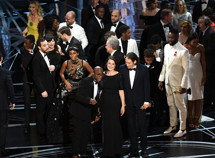 Producer Adele Romanski, writer/director Barry Jenkins and producer Jeremy Kleiner accept the Best Picture Oscar for "Moonlight."