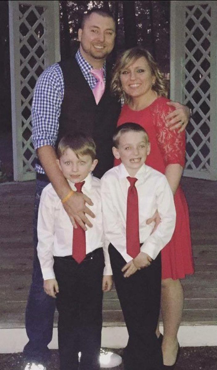 John with Tara and their sons, Caeden and Camden, at her sister's wedding, February 2017.
