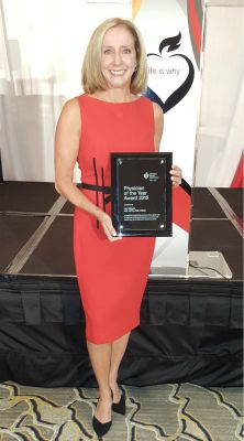 <p>Lori Mosca with the award naming her the 2015 Physician of the Year from the American Heart Association.</p>