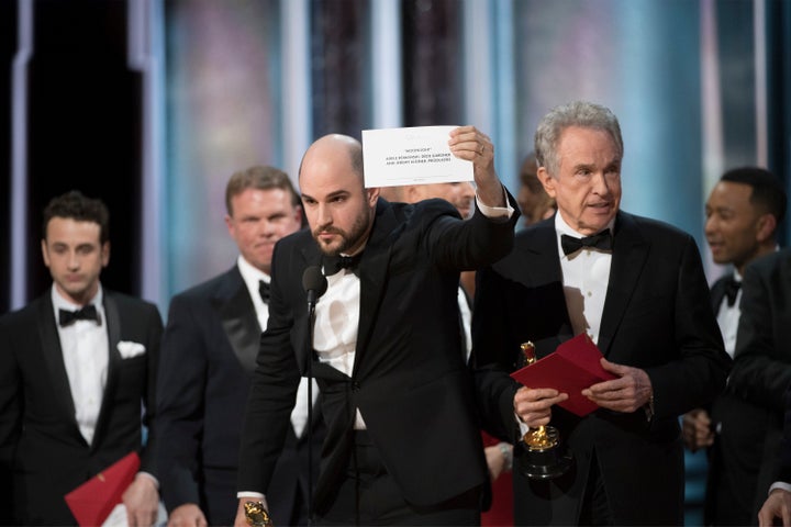 "La La Land" producer Jordan Horowitz holds up the card showing that "Moonlight" had won the Oscar for best picture at the Academy Awards on Sunday.