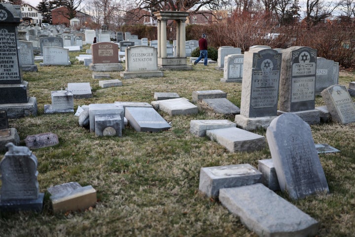 Vandalized tombstones are seen at the Jewish Mount Carmel Cemetery, Feb. 26, in Philadelphia. Police say more than 100 tombstones were vandalized a week after a Jewish cemetery in St. Louis was desecrated.