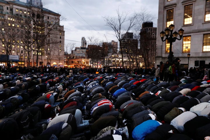 Demonstrators pray as they participate in a protest by the Yemeni community against U.S. President Donald Trump's travel ban