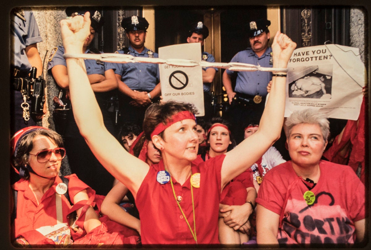 Pro-choice demonstrators in downtown Manhattan protest the July 3rd, 1989, Supreme Court Webster decision which limited Roe v. Wade. This was a turning point in the pro-choice movement. Twenty-four were arrested, including activist Mary Lou Greenberg, as they stormed the Brooklyn Bridge. (Nina Berman, 1989.)