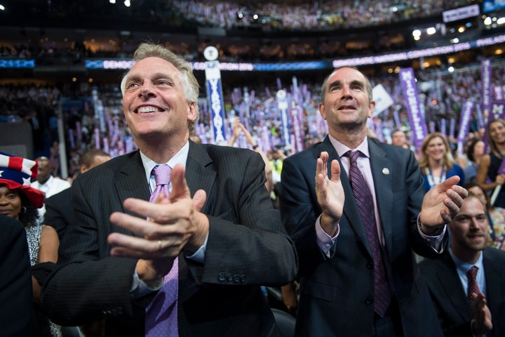 Virginia Gov. Terry McAuliffe, left, and Lt. Gov. Ralph Northam cheer on the floor of the Democratic National Convention in Philadelphia last summer. McAuliffe has endorsed Northam as his successor.