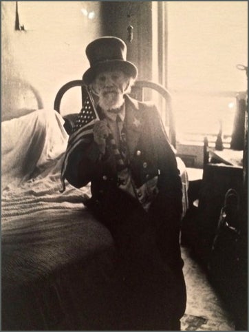 Uncle Sam leaning on a cot at home, N.Y.C., 1960