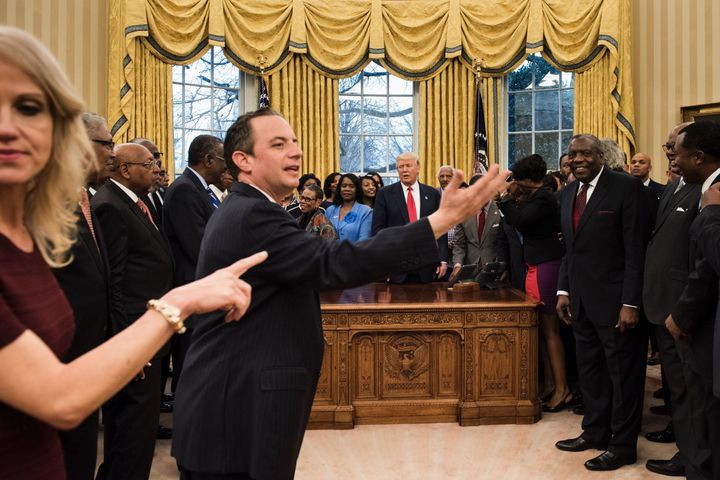This photograph taken before the viral picture shows Conway, left, apparently directing media in the Oval Office