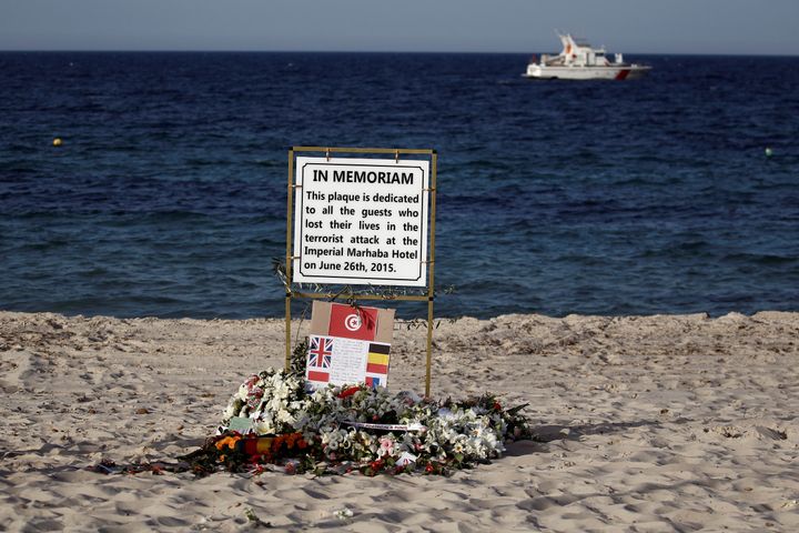 A plaque dedicated to victims is pictured on the beach of the Imperial Marhaba resort