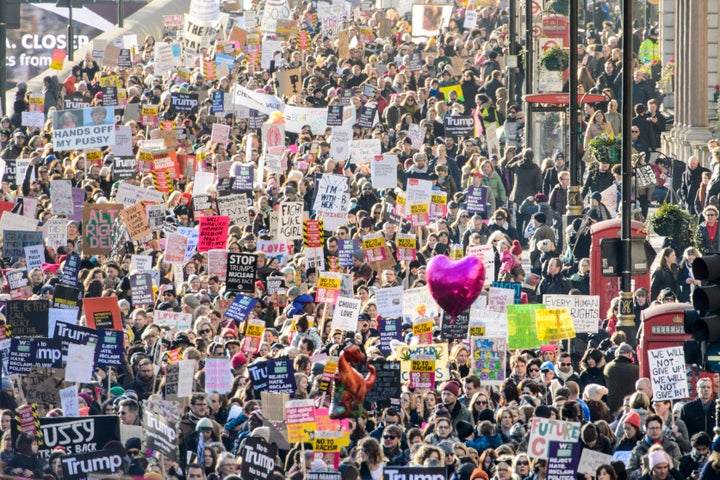 Demonstrators walk down Piccadilly during the Women's March on London, where protesters marched to promote women's rights in the wake of the US election result.