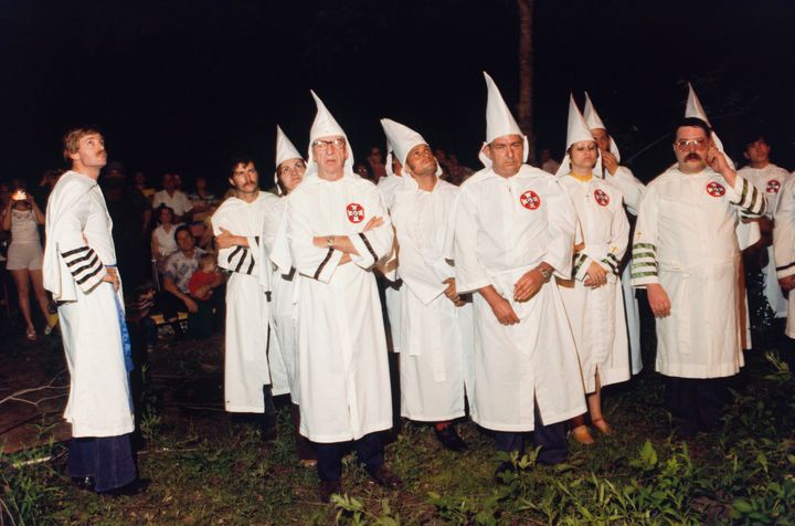 David Duke (far left) at a KKK cross-burning in the 70s.