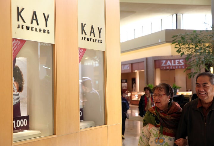 Shoppers walk by a Kay Jewelers and Zales Jewelers stores at the Serramonte Mall on Feb. 19, 2014 in Daly City, California.